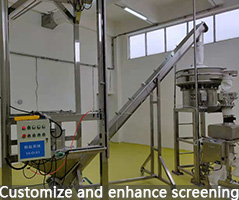 Ton package feeding station with screw conveyor